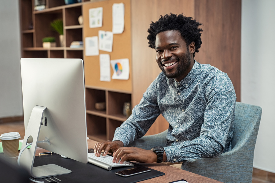 Creative Black Businessman Working on Computer